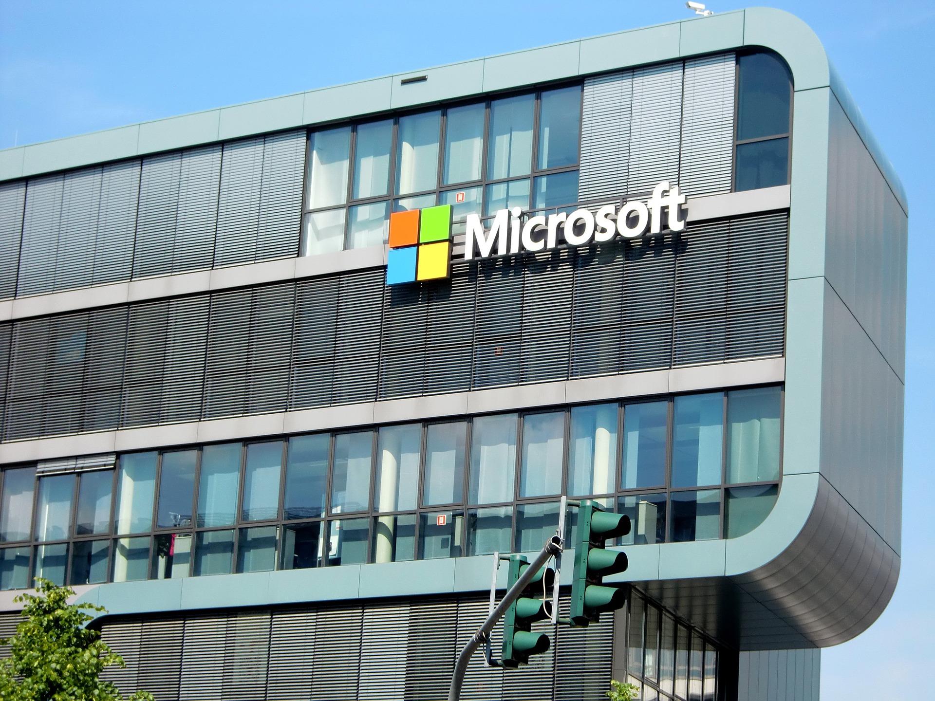 A large glass building with "Microsoft" on the side of it