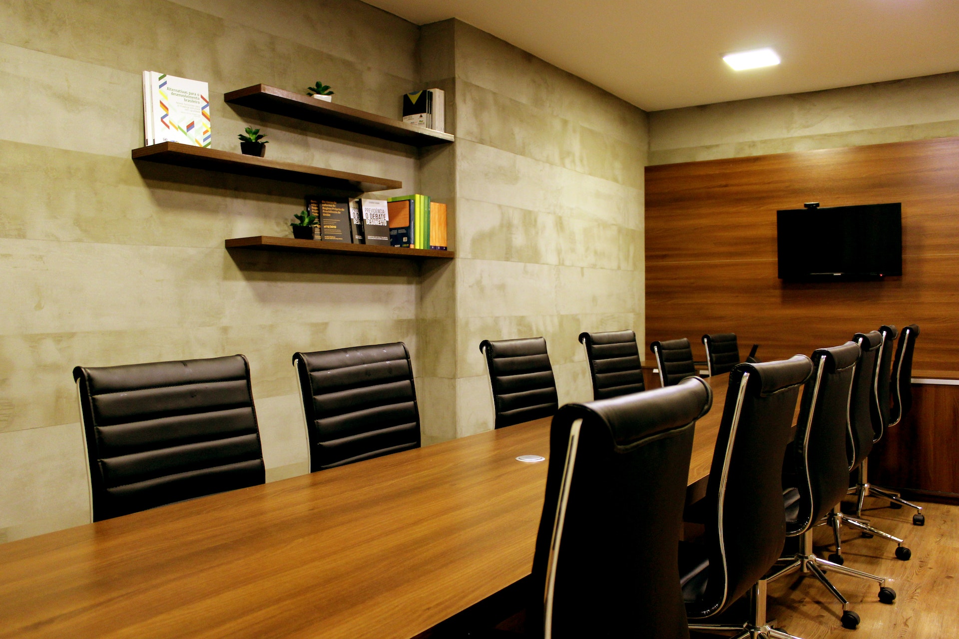 Boardroom with several leather backed chairs